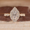 Dutch Marquise Ring With Round Cut Halo Setting And Pave Band.