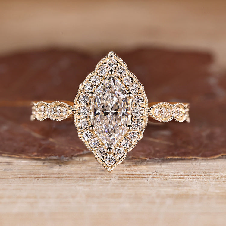 Dutch Marquise Ring With Round Cut Halo Setting And Pave Band.