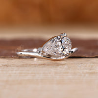 Diamondrensu engagement ring showcasing pear solitaire in east west style.
