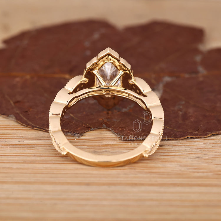 Dutch Marquise Diamond Ring With Halo And Milgrain Details.