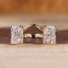 Radiant cut gold engagement ring featuring two stone design in yellow gold.
