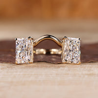 Radiant cut gold engagement ring featuring two stone design in yellow gold.
