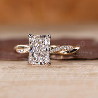Custom diamond ring featuring radiant cut center and twisted shank.
