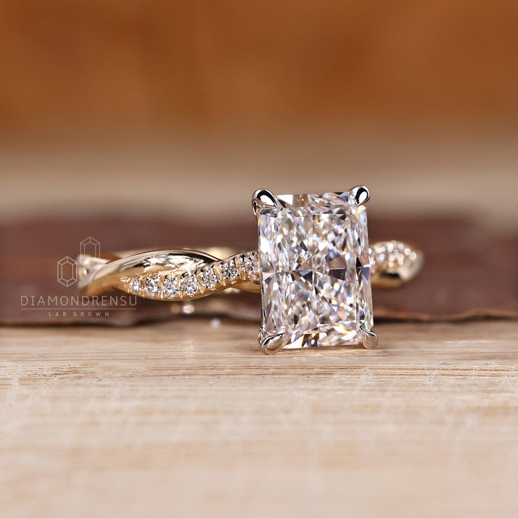 Handmade ring with two tone yellow and white gold and radiant cut diamond.
