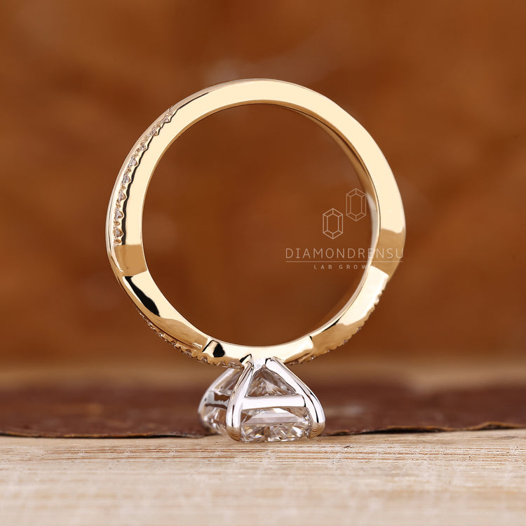 Handmade jewelry engagement ring with two tone gold and secure 4 prong setting.
