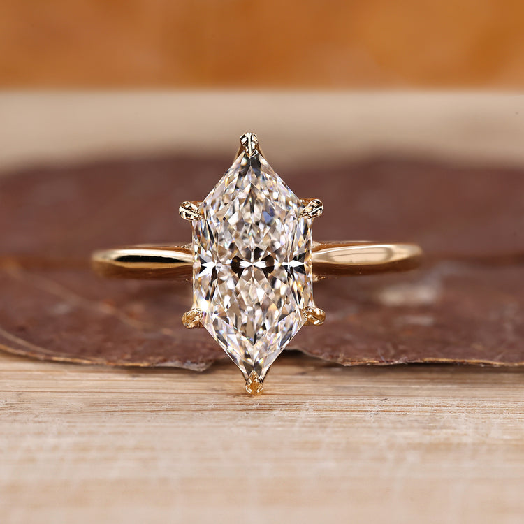 Hidden halo ring with Dutch marquise diamond in yellow gold setting.

