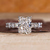 Radiant diamond ring with pave setting in white gold.
