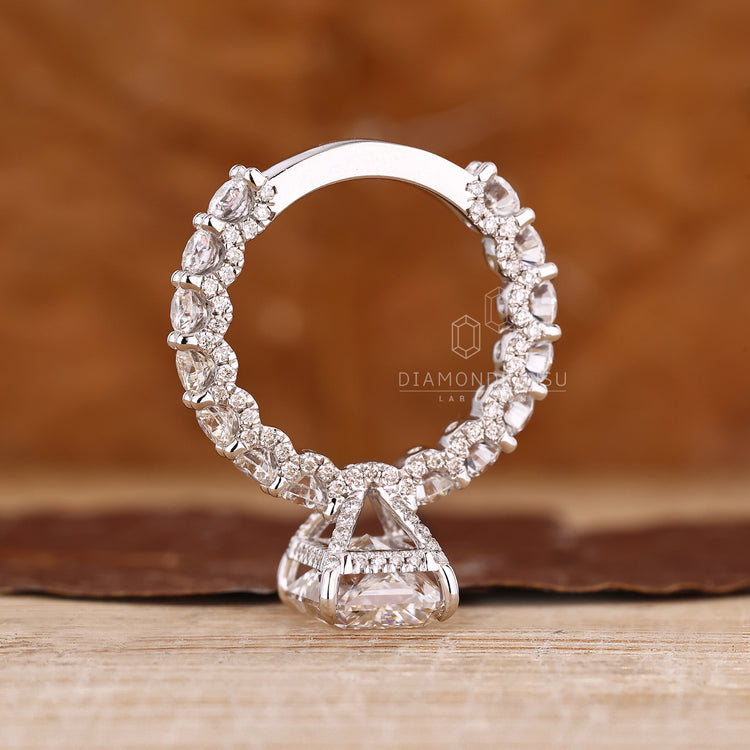 Diamondrensu engagement ring featuring radiant diamond and pave detailing.
