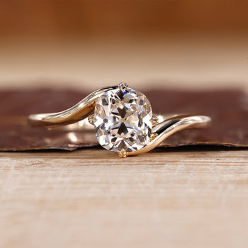 Old European cut diamond ring with cushion OEC center and solitaire setting.
