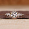 Old european cut ring with round diamond and five stone design.