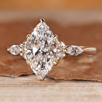 Six claw prong setting on a marquise diamond ring.