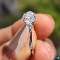 White gold three-stone moissanite ring for elegant proposals.