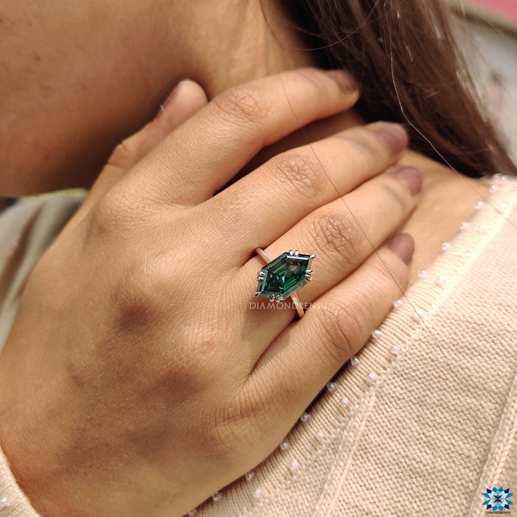 Diamondrensu ring with a double claw prong and cathedral mount.
