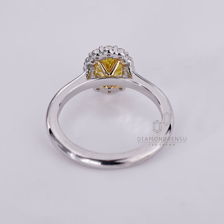 IGI certified lab-grown diamond halo ring with oval center stone.
