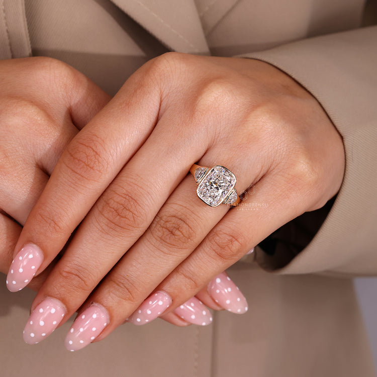 Cushion cut center diamond ring with bezel setting.
