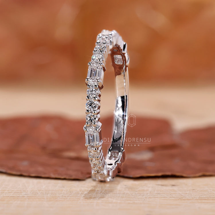 Emerald and Round Wedding Band for a unique look.
