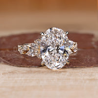 Oval diamond engagement ring in four claw prong setting.
