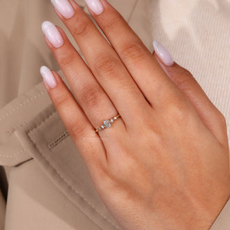 Round cut side stone engagement ring featuring 6 prong settings.
