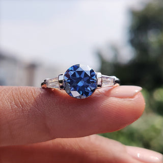 Three stone moissanite ring in white gold.