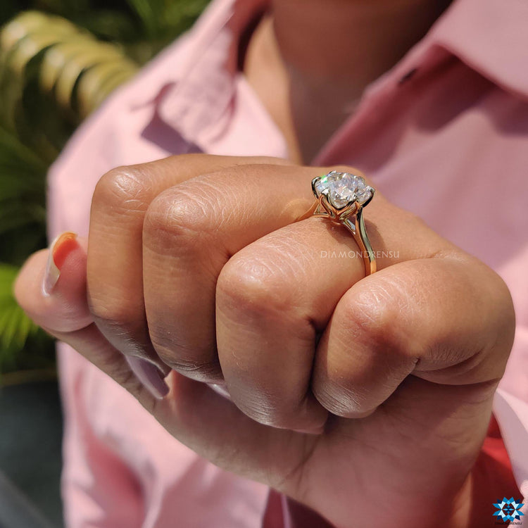Yellow gold moissanite ring for a bold look.
