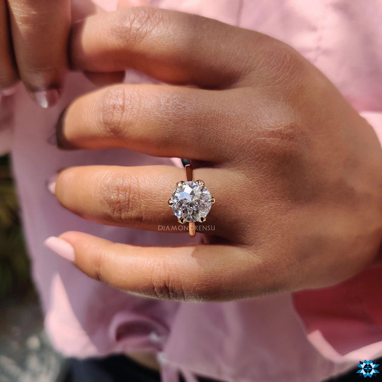 Floral basket setting ring with intricate detailing.
