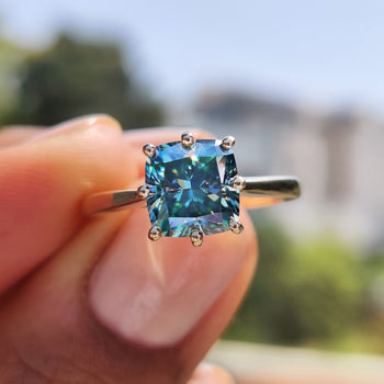 Cushion cut moissanite engagement ring with stunning clarity.
