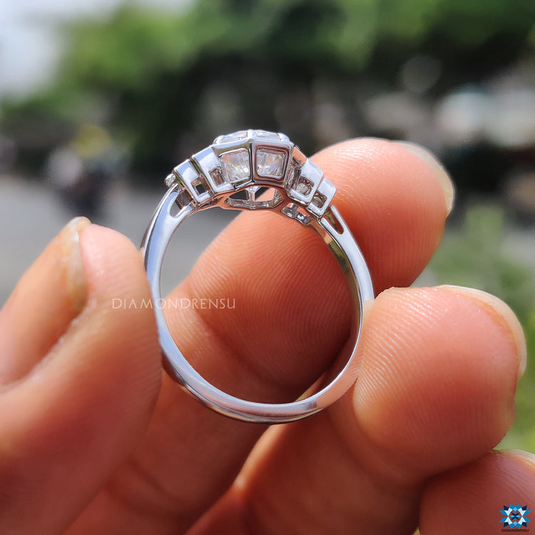 Claw prongs hold the moissanite securely on a custom ring.
