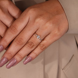 IGI certified 5 stone diamond ring with round cut side stones.
