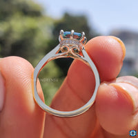 Cyan blue moissanite ring with a vibrant and unique hue.
