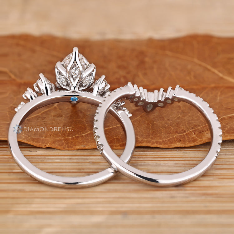 Marquise wedding ring with six claw prong setting.
