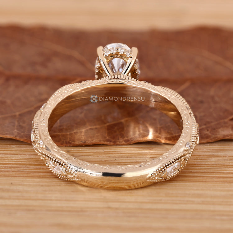 Oval lab grown diamond ring with art deco details.