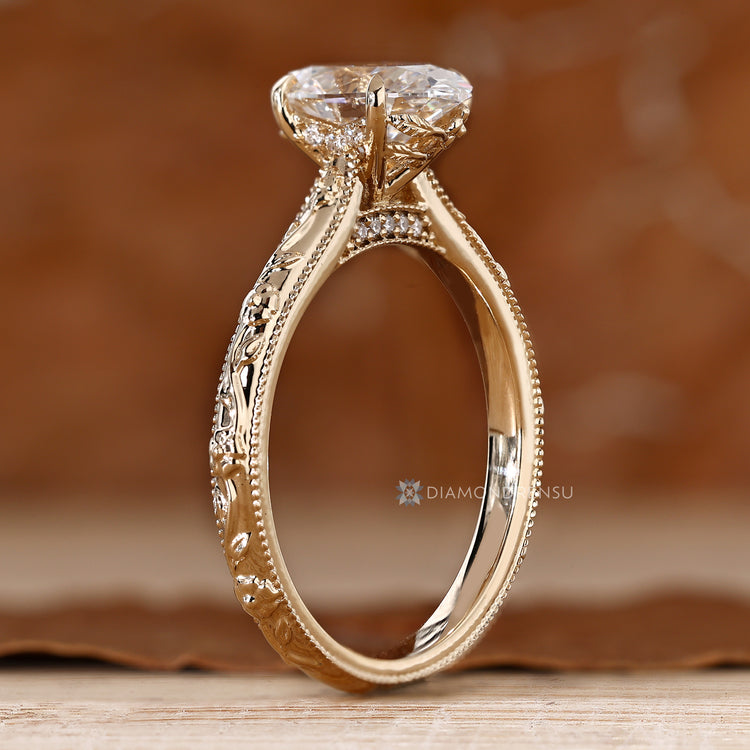 Handmade oval solitaire ring with a four claw prong setting.