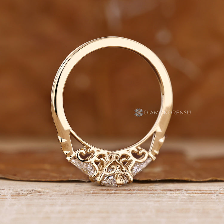 Diamondrensu handmade ring with marquise center stone and kite side stones.