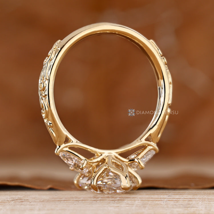 Art Deco Dutch marquise ring with kite side stones and a tulip setting.