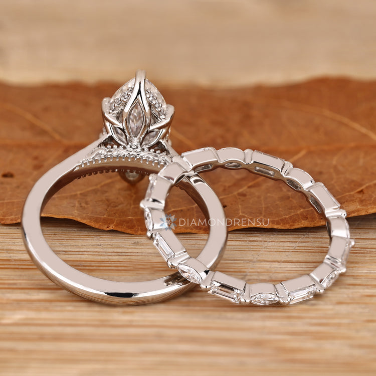 Solitaire marquise ring with hidden halo style.