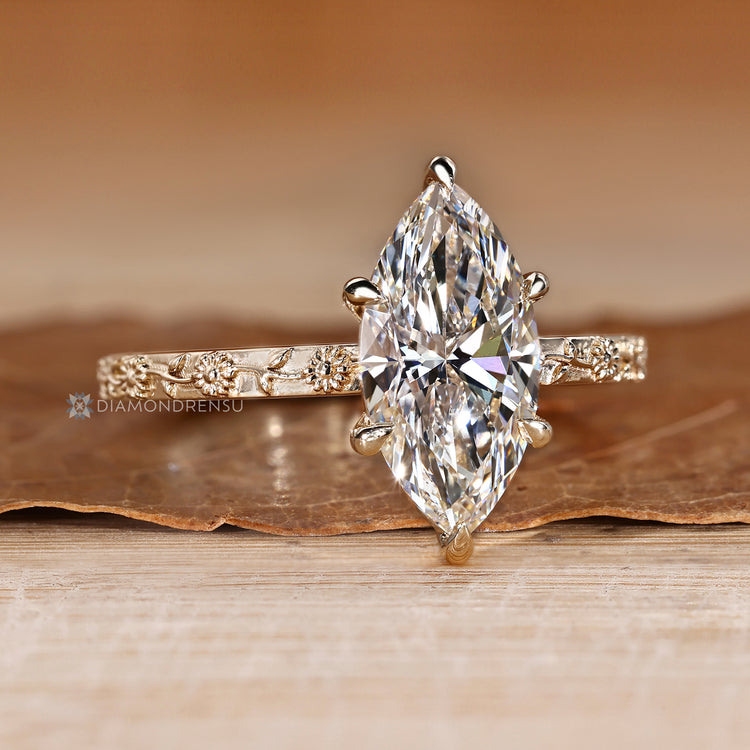 Marquise diamond ring with a six claw prong setting.