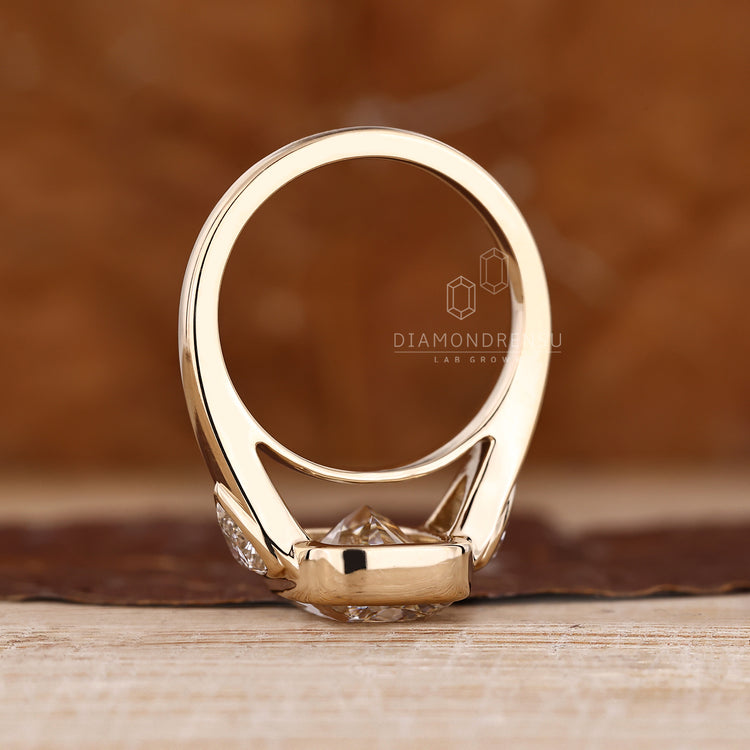 Three diamond engagement ring with cathedral setting.
