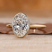 Solitaire style oval cut engagement ring.