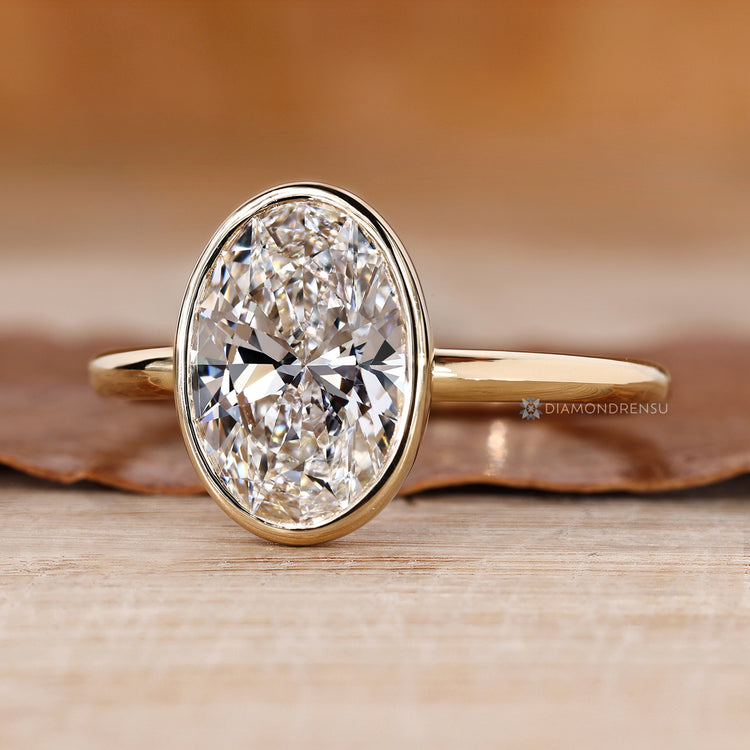 Solitaire style oval cut engagement ring.