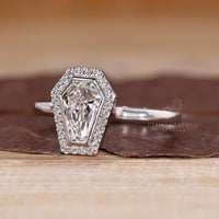 Diamondrensu coffin ring with lab grown diamond center stone.