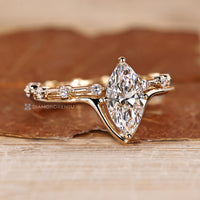 Round band complements the marquise cut wedding ring.