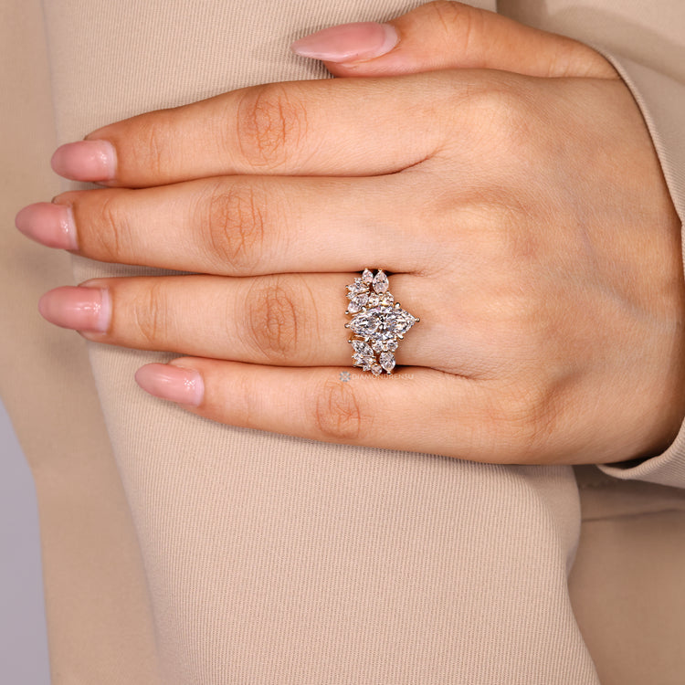 Marquise ring with muse setting and round stones.
