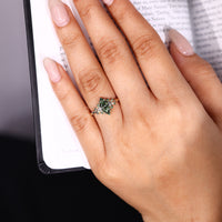 Handmade green marquise ring with four prong setting.