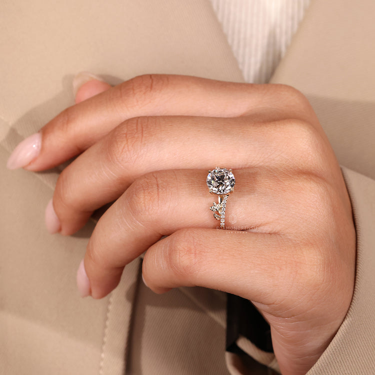 Handmade nature inspired ring with round old european cut diamond leaf style.
