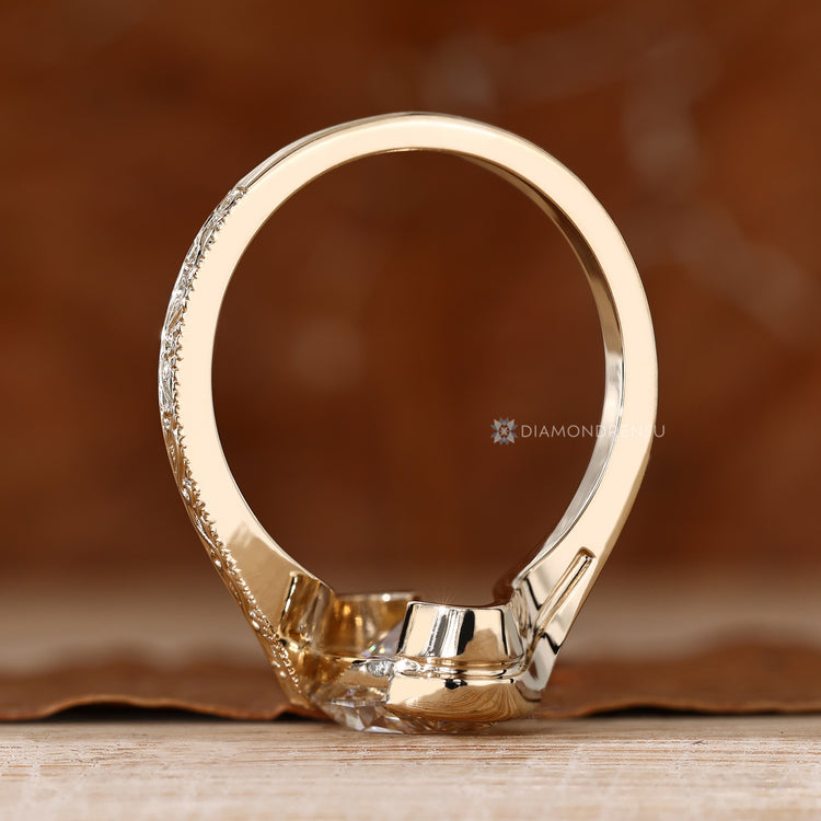Art Deco oval diamond ring with milgrain details.
