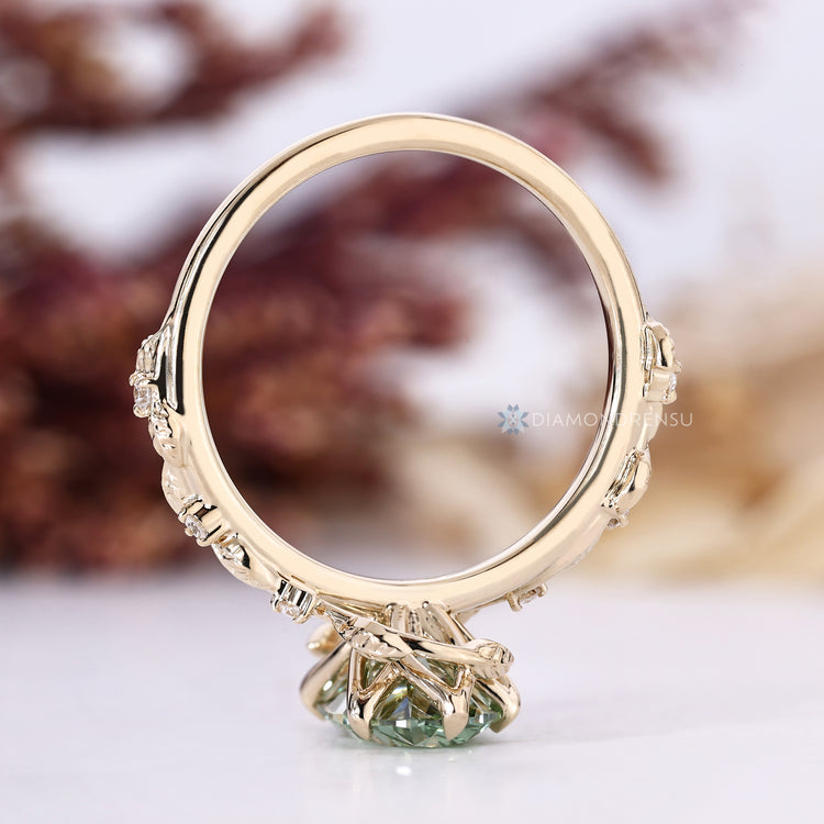 Oval engagement ring with a nature inspired tulip setting.