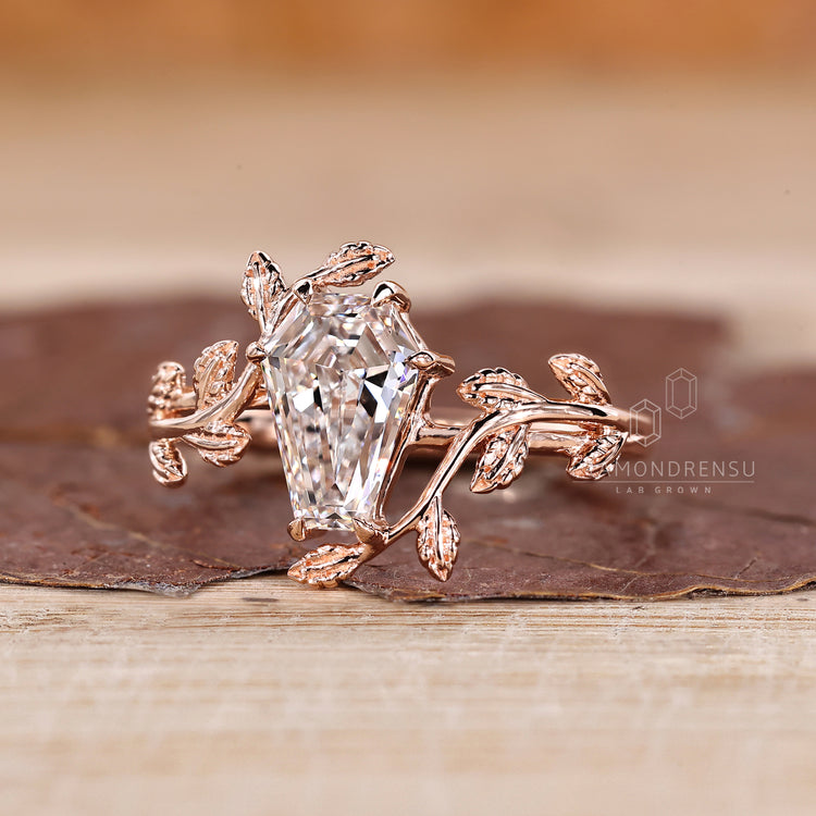 Diamondrensu coffin ring with lab grown diamond center stone.