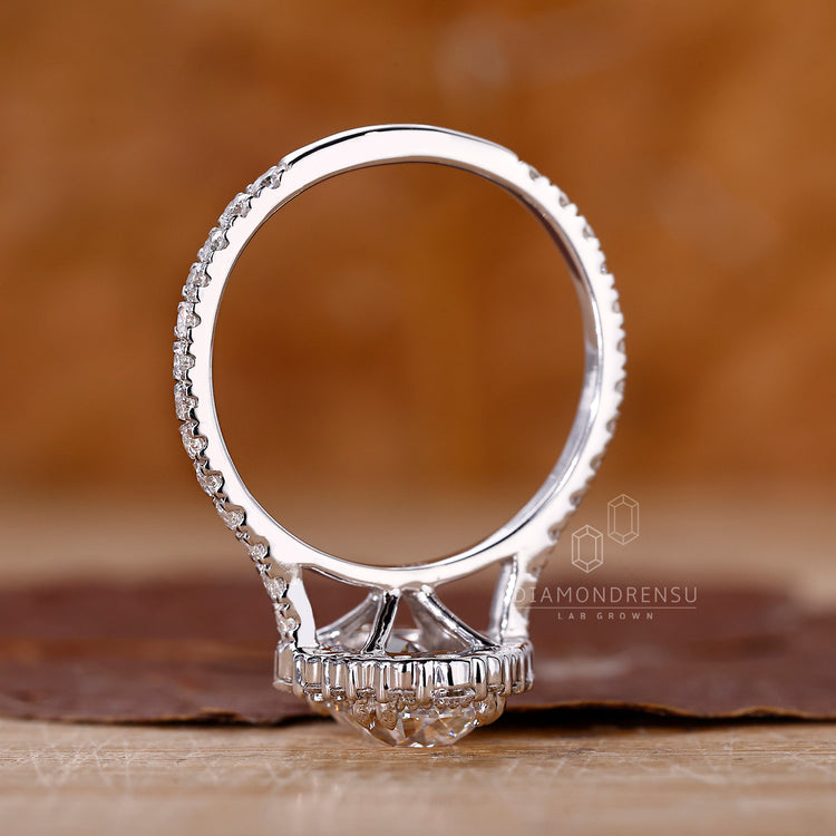 Cathedral style ring with cushion old mine center and pave band.
