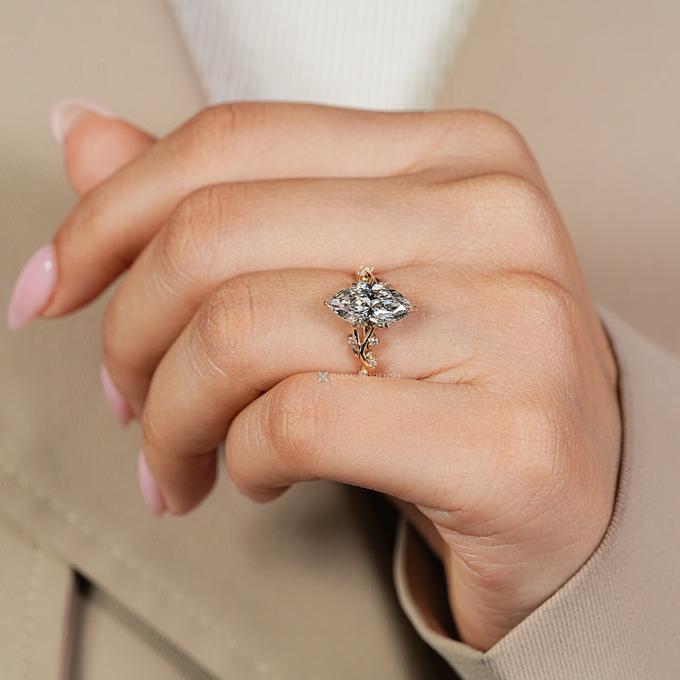 Cluster setting surrounds the hidden blue gemstone.