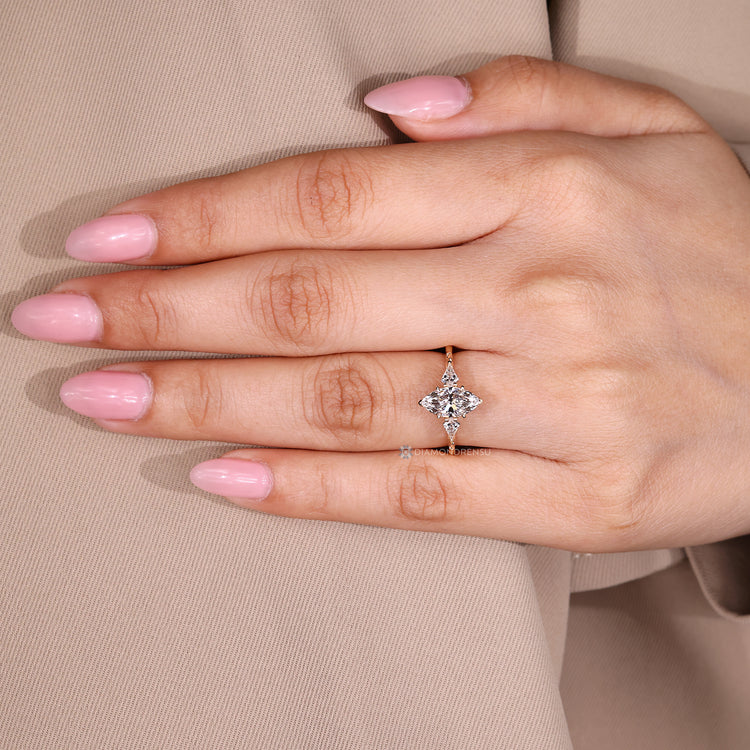 Art Deco diamond ring with three stone style and tapered shank.